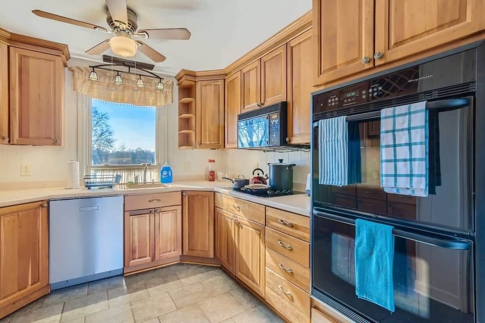 Enjoy the full kitchen with a refrigerator, freezer, oven, stove, microwave, dishwasher, coffee, creamers, mixers, spices, pots, pans, cooking supplies, cutlery, cups, plates, bowls, utensils, small appliances, and many more essentials!