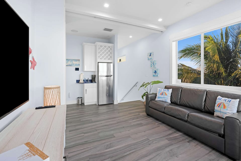 With a comfy couch and a TV just waiting for your favorite shows, this space is perfect for unwinding after a day of adventures.