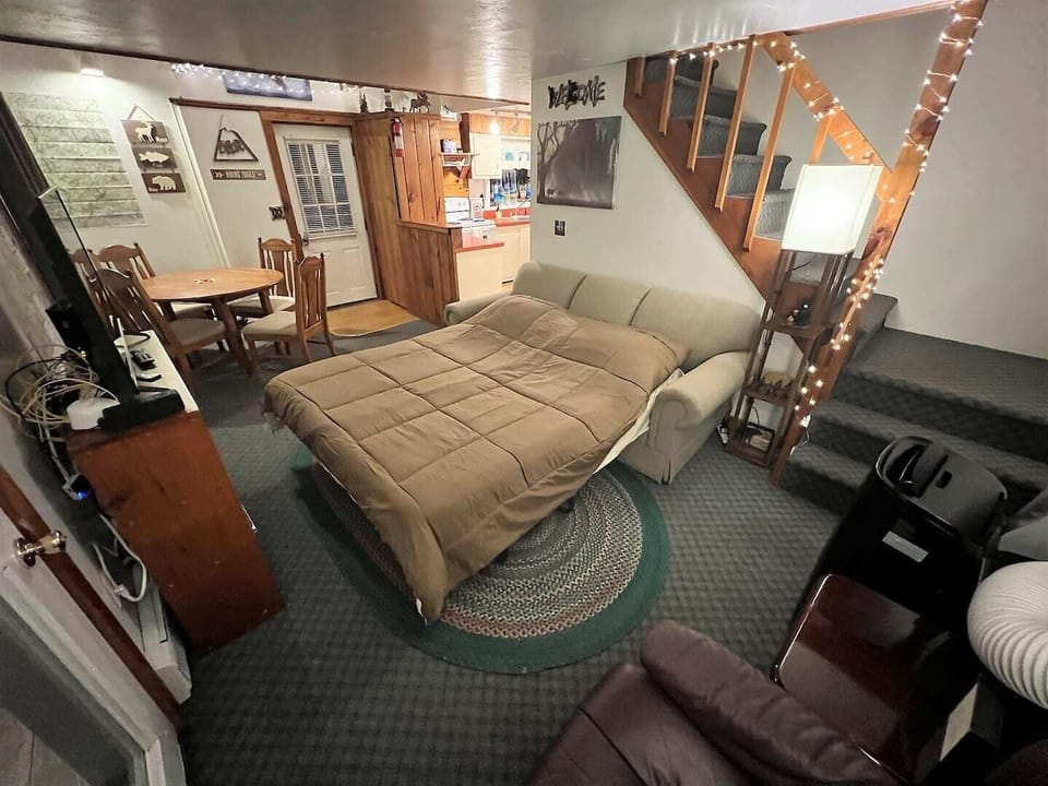 The LaZ Boy sofa is a comfortable place to sit and rest as a couch, or pulls out into a second queen bed for bigger groups.
