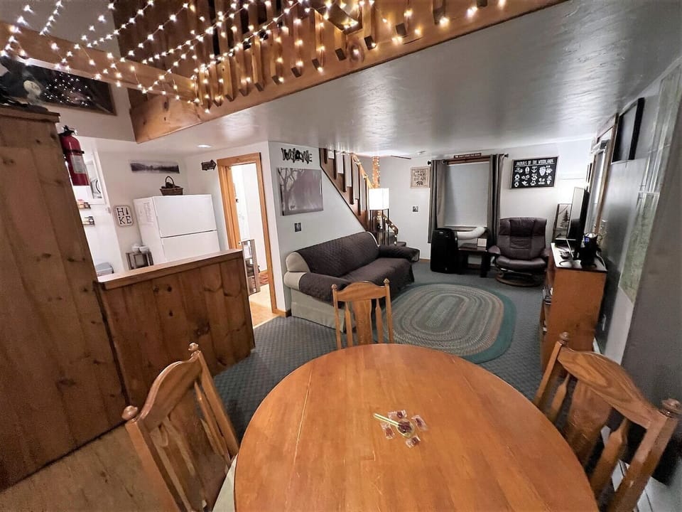 View from the dining area into the living room and kitchen