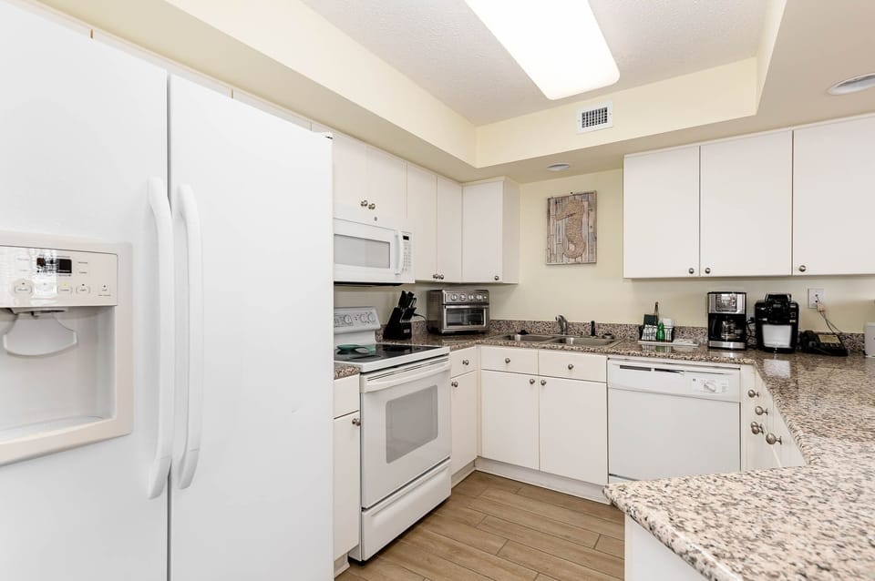 Condo, 2 Bedrooms | Private kitchen | Coffee/tea maker, fridge, oven, toaster