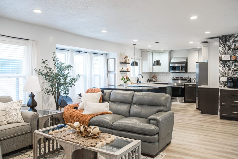 Relax on the La-Z-Boy leather couch enjoy the ambience of the colorful fireplace