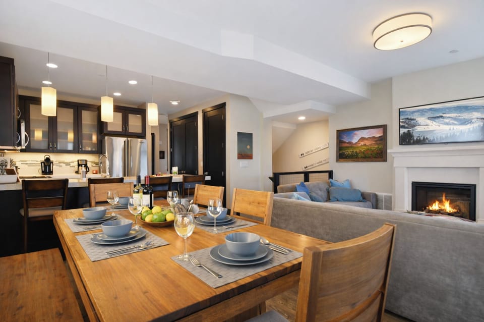 A spacious open-concept dining area designed for memorable group meals, easy entertaining, and gathering together after a day on the mountain.