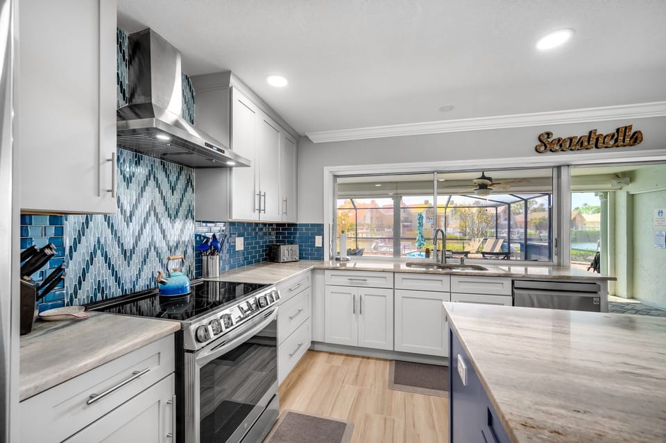Wonderful chef's kitchen with views to the outdoors.