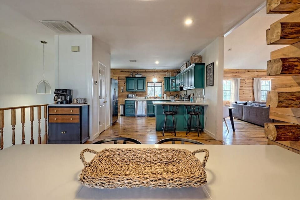 The open kitchen & dining area is adjacent to main floor living room and perfect for enjoying meals.