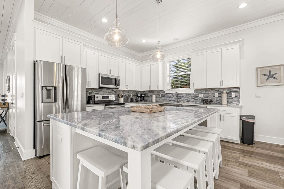 Large island with barstool seating.