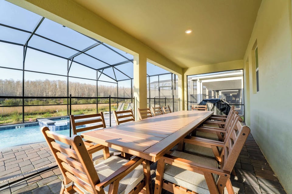 Relax and dine al fresco on this spacious patio with pool views, perfect for large gatherings.
