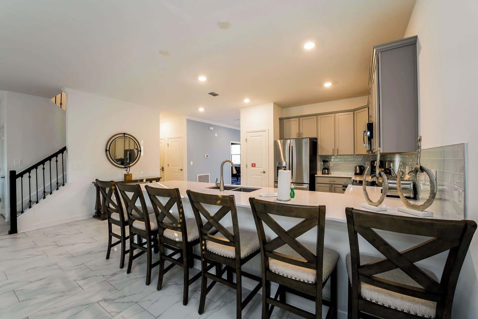 Spacious kitchen with a large island perfect for gatherings and culinary adventures.