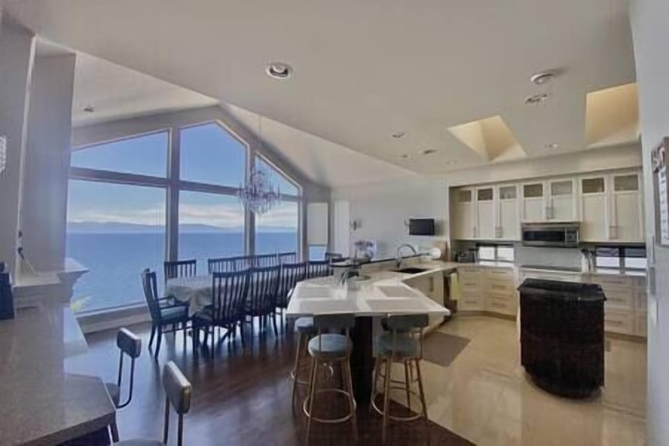 Dining Rm(13ft cathedral ceiling)/Kitchen area - Dining Table Seats 12 ; and 4 - 6 on the island. 