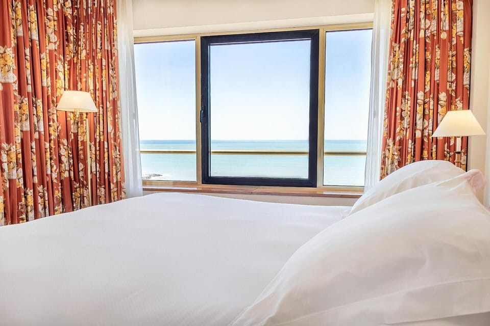Frette Italian sheets, premium bedding, down comforters, minibar