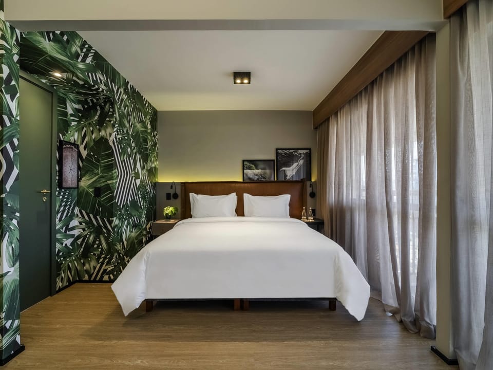Deluxe Room, 1 King Bed, Balcony | Minibar, in-room safe, desk, blackout drapes