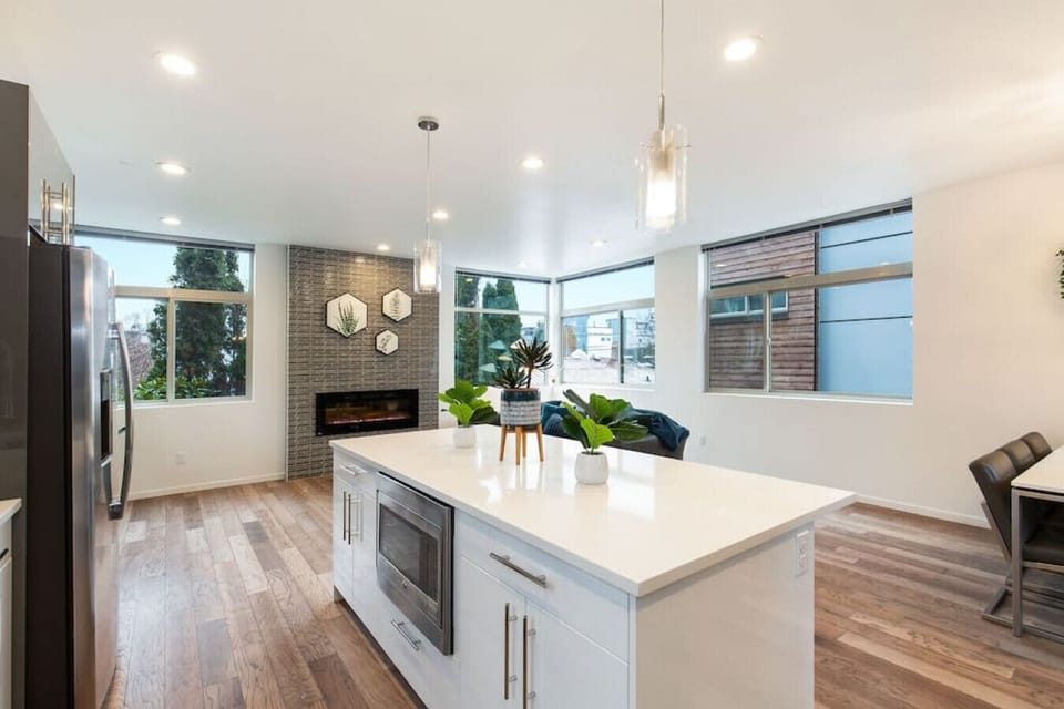 The spacious kitchen island presents the focal point of the living area.