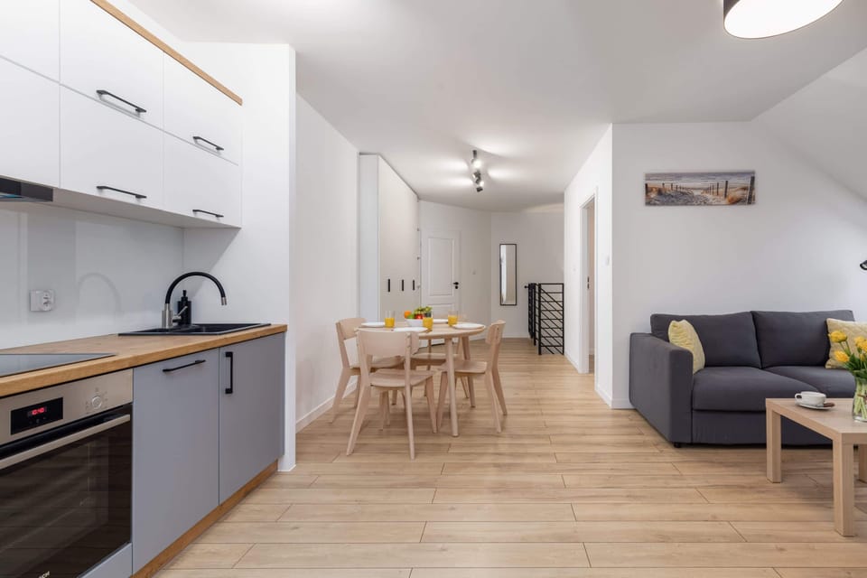A kitchen with plenty of storage space, modern appliances, and a sleek design.


