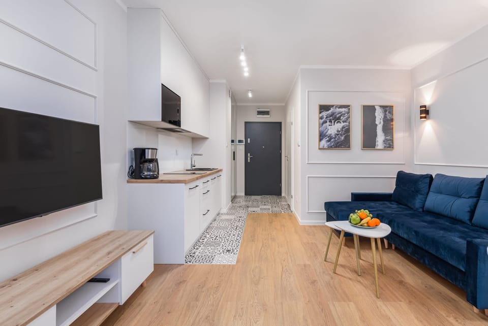 A sleek, compact kitchen with modern appliances and a minimalistic design.

