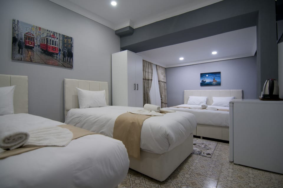 Standard Family Room | Minibar, iron/ironing board, free WiFi, bed sheets