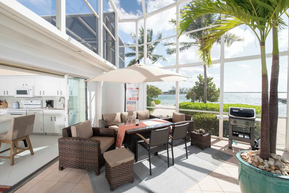 Outdoor dining table and propane grill. 