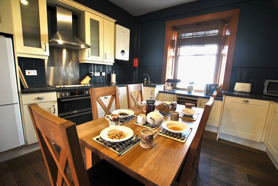 Spacious kitchen dining room leading to living room