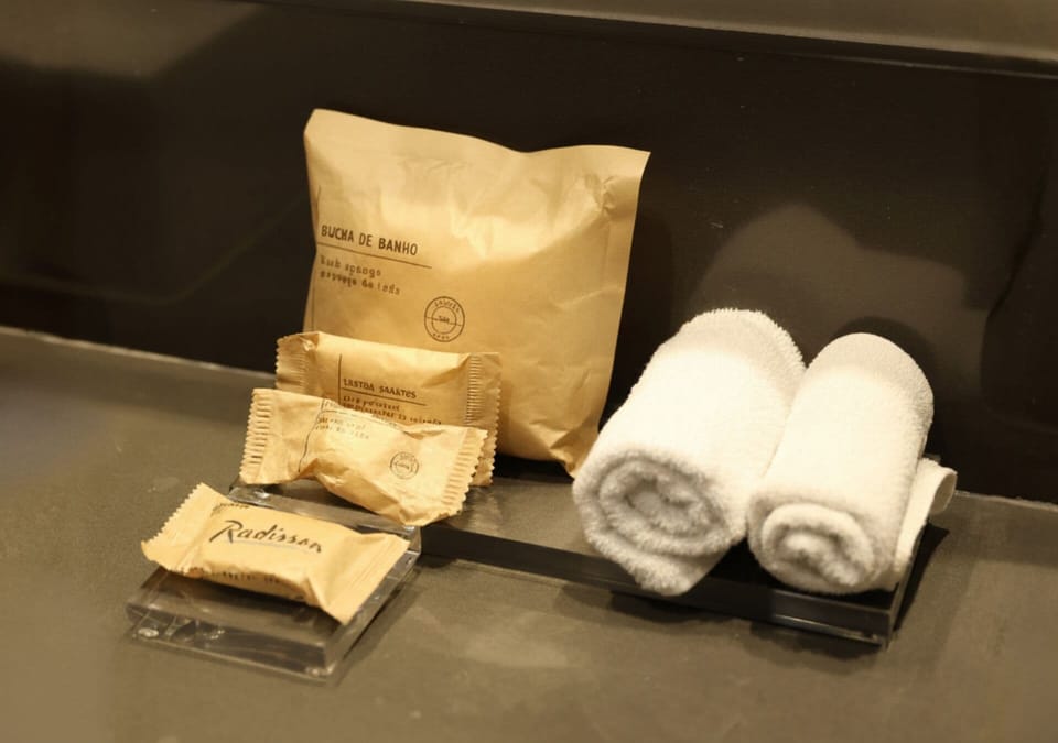 Shower, rainfall showerhead, hair dryer, towels
