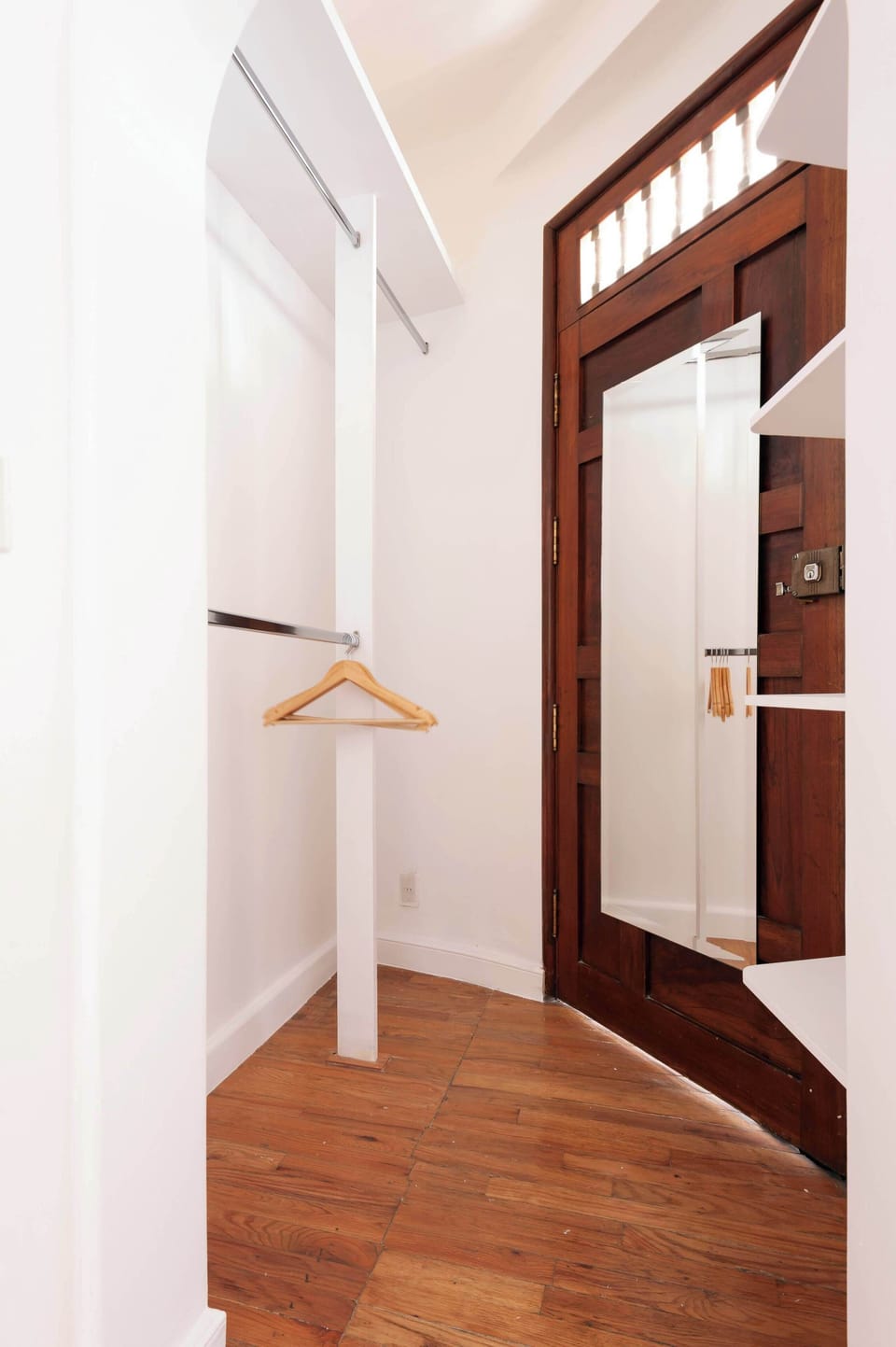 Warm and functional entrance with open wardrobe