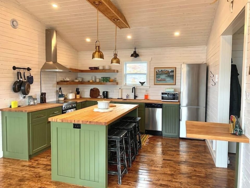Fully equipped custom kitchen with a large island.