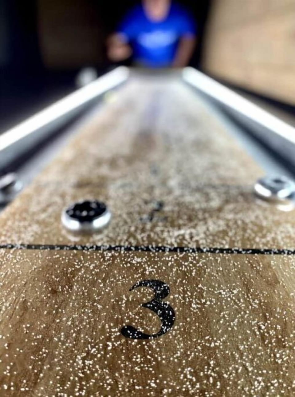 Lighting around the shuffleboard adds to the fun!