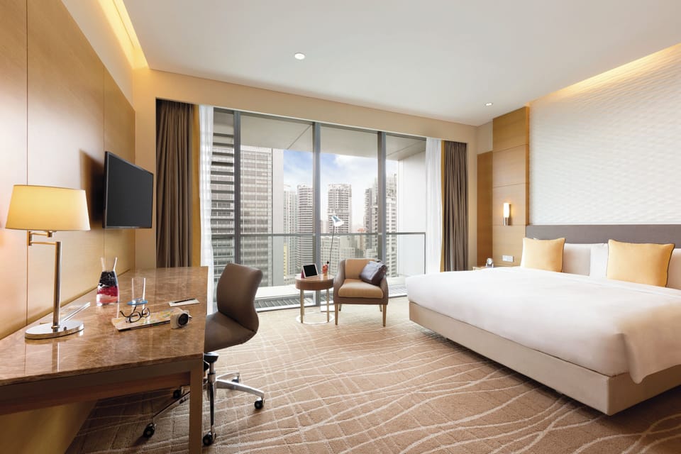 Deluxe Room, 1 King Bed | In-room safe, desk, blackout drapes, iron/ironing board (on request)