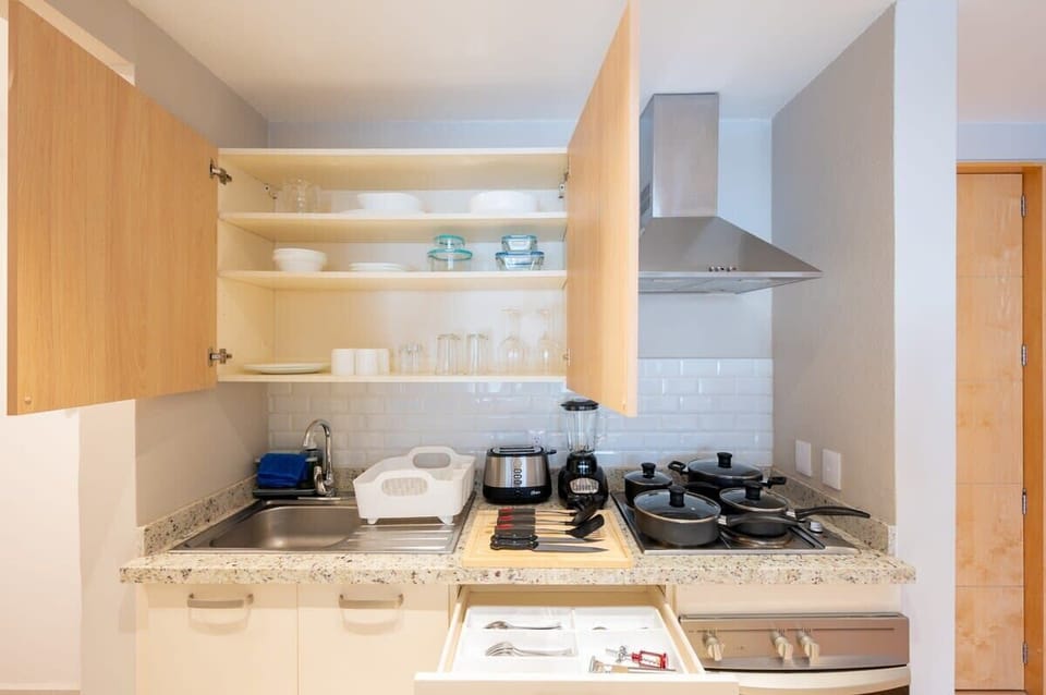 Fully equipped kitchen with appliances and utensils