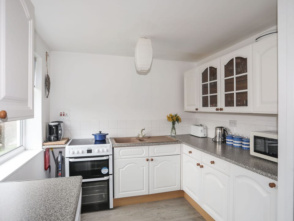 Fridge, electric kettle, toaster, cookware/dishes/utensils