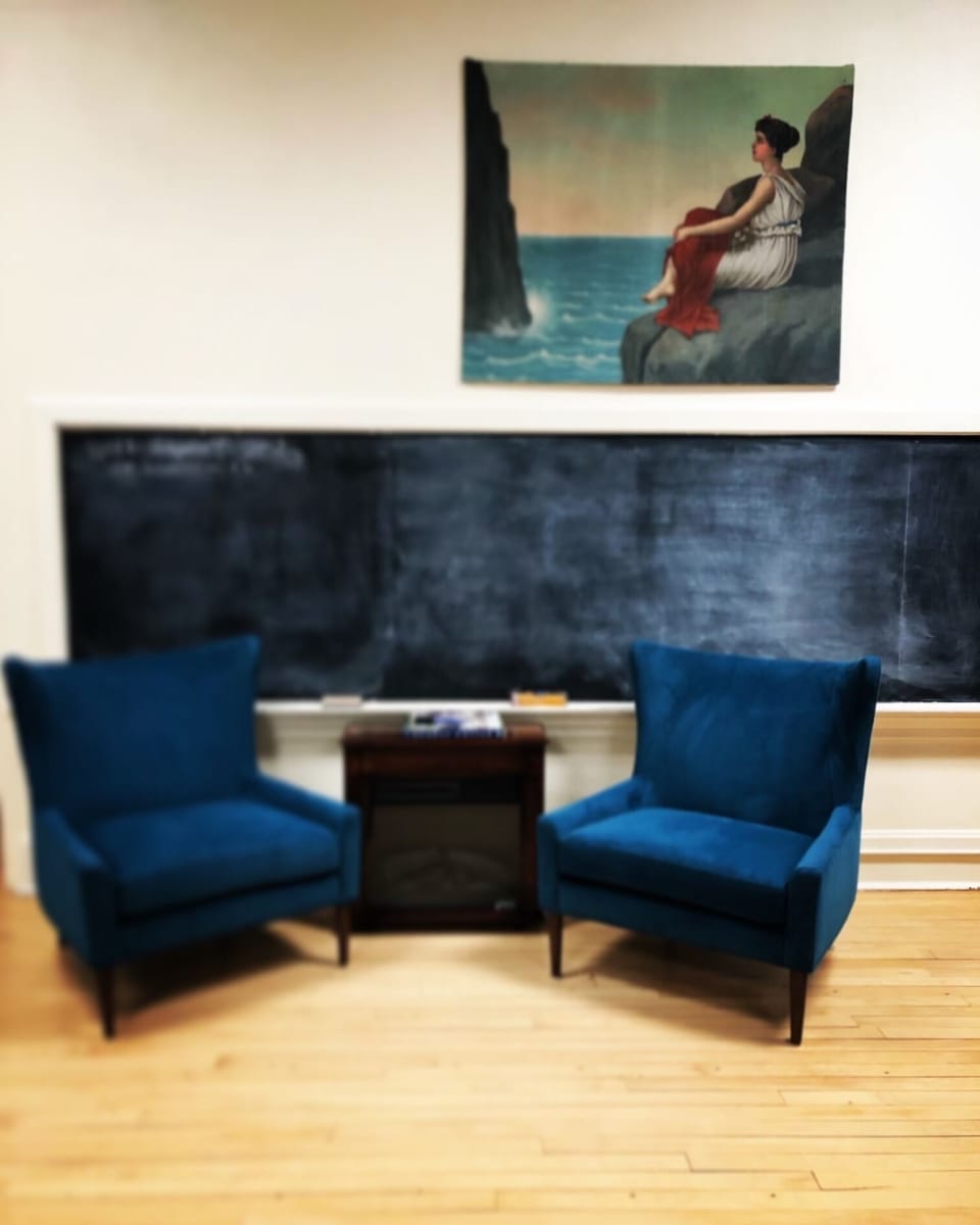 Your private cozy sitting area, with chalkboard to plan your adventures.