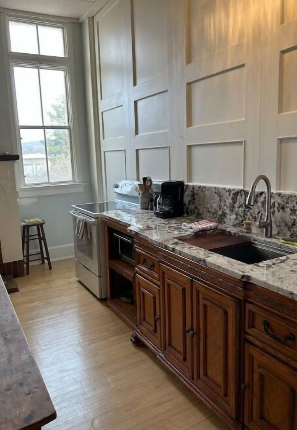 Granite countertops with stainless steel farm sink