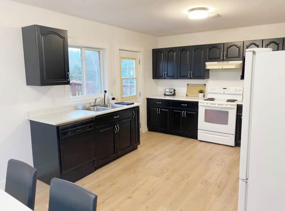 The kitchen is equipped with all utensils and cookware.