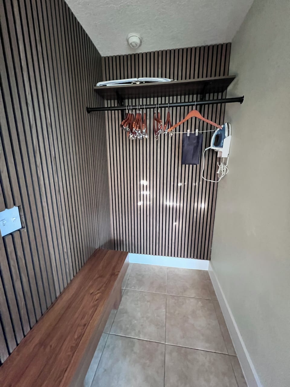 Closet area with iron and ironing board