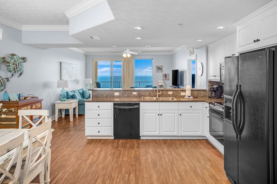 Open kitchen with ocean views and a bright living area