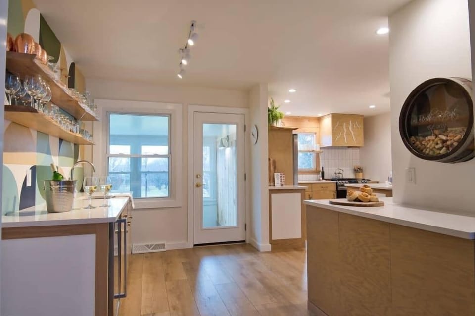 Directly next to the Lounge is our wetbar to the left, kitchen and coffee counter to the right.  Keep your beverages cold in the cooler under the bar counter.