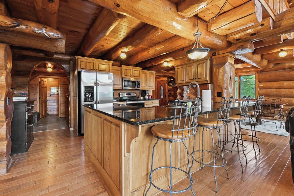 Main level kitchen is fully equipped and has a large center island with seating