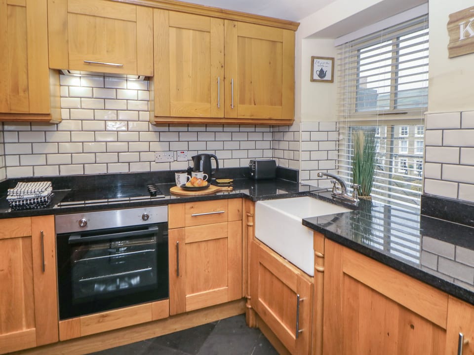 Fridge, electric kettle, toaster, cookware/dishes/utensils