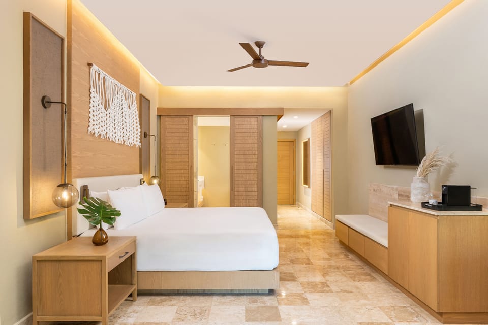 Premium bedding, down comforters, free minibar, in-room safe
