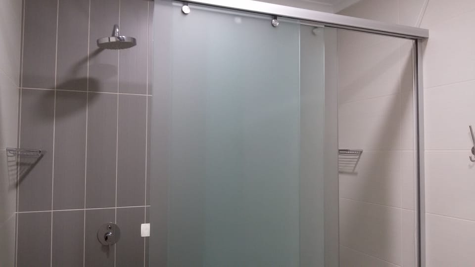 Family Room, Private Bathroom | Bathroom | Shower, hair dryer, towels