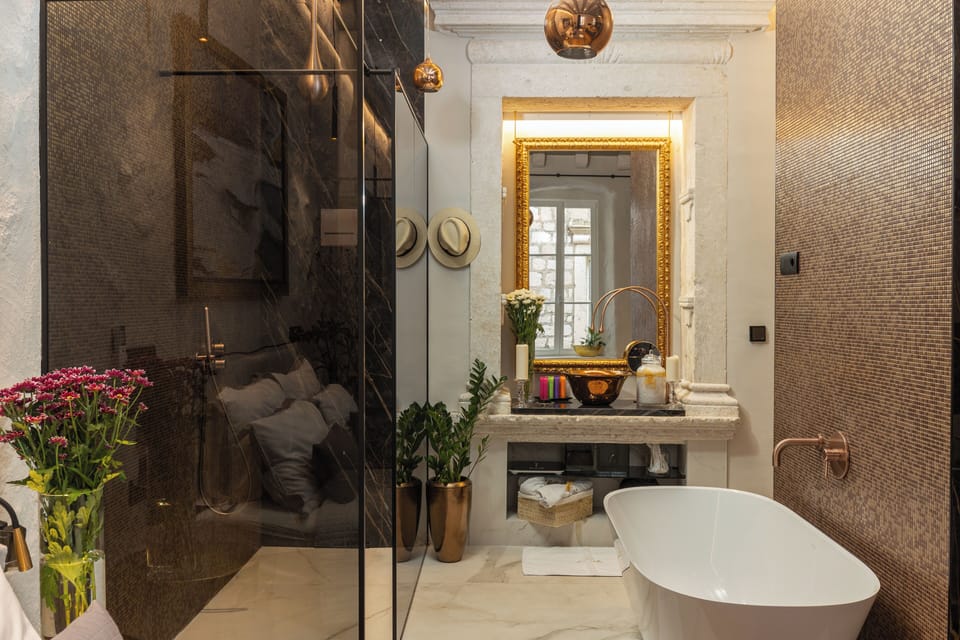 Luxury Double Room | Bathroom | Separate tub and shower, rainfall showerhead, designer toiletries