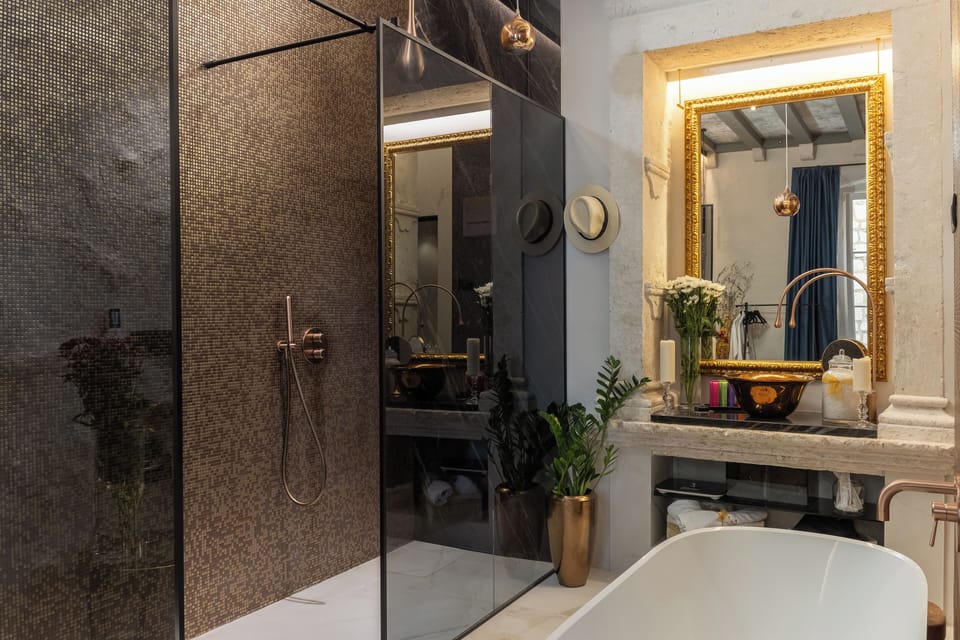 Luxury Double Room | Bathroom | Separate tub and shower, rainfall showerhead, designer toiletries
