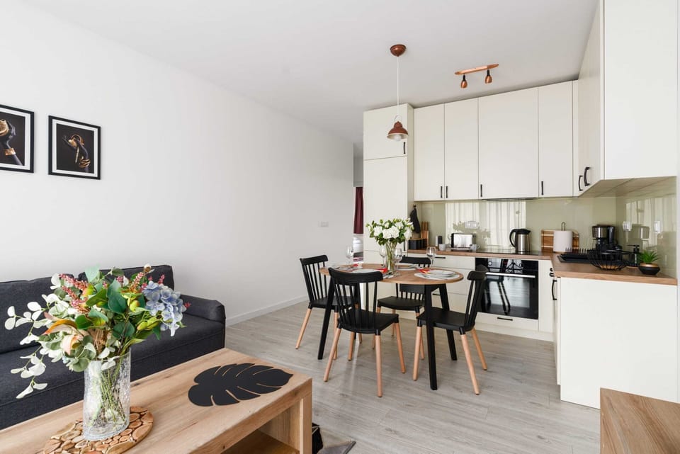 An open-plan kitchen and dining area, harmonizing modern design with functionality.

