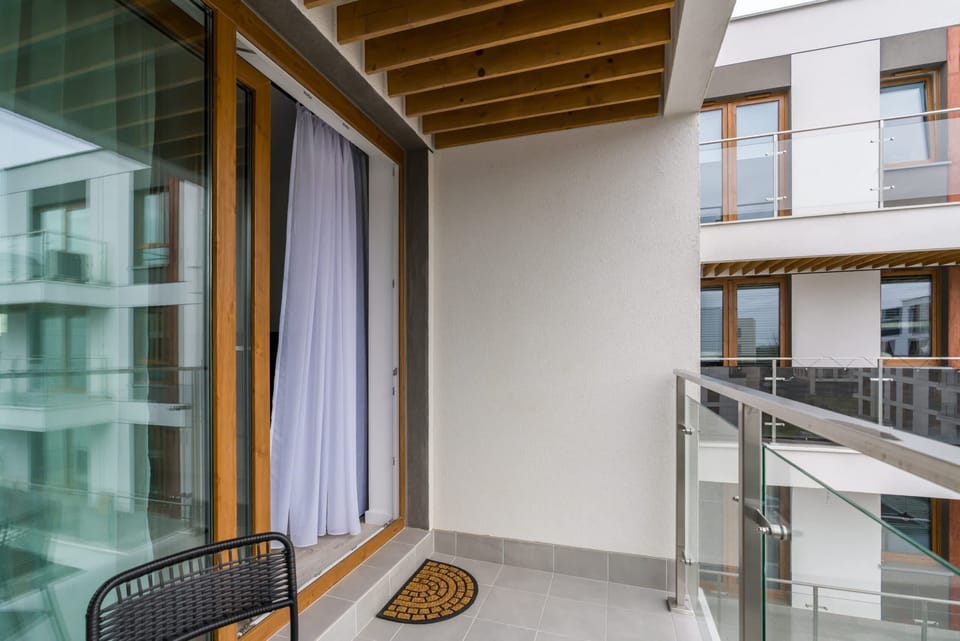 A unique angle of the balcony showing wood finishes and sleek design details.

