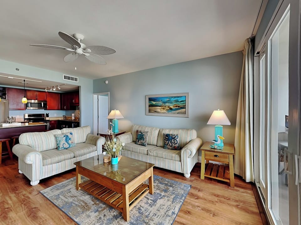 Living Area - Queen Sofa Sleeper + Balcony Access