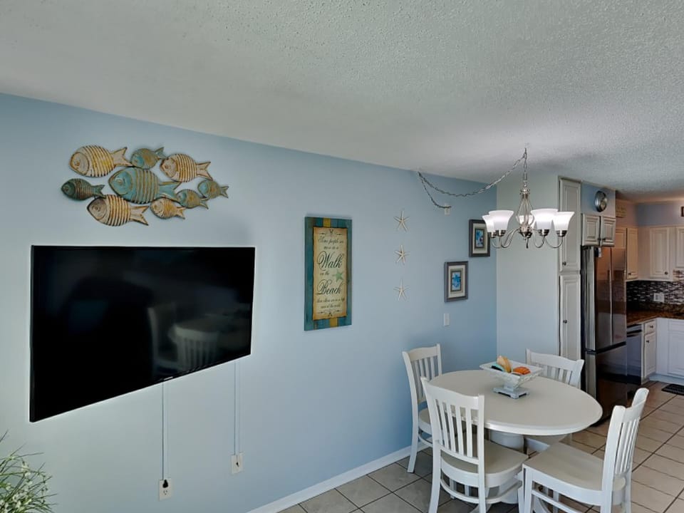 Living Room TV and Dining Area