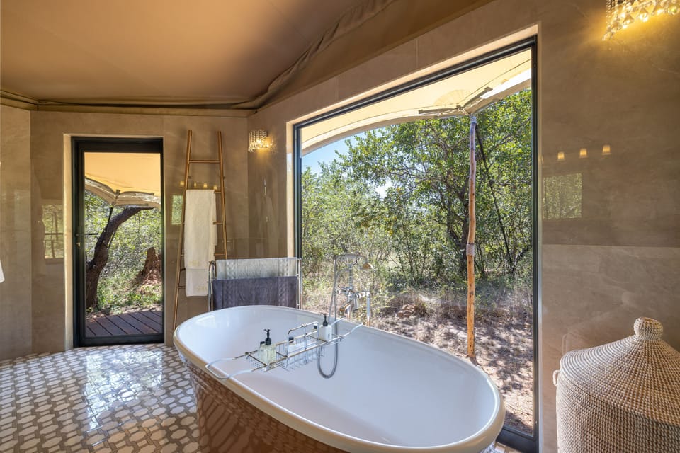 Royal Studio Suite | Bathroom | Designer toiletries, hair dryer, bathrobes, slippers