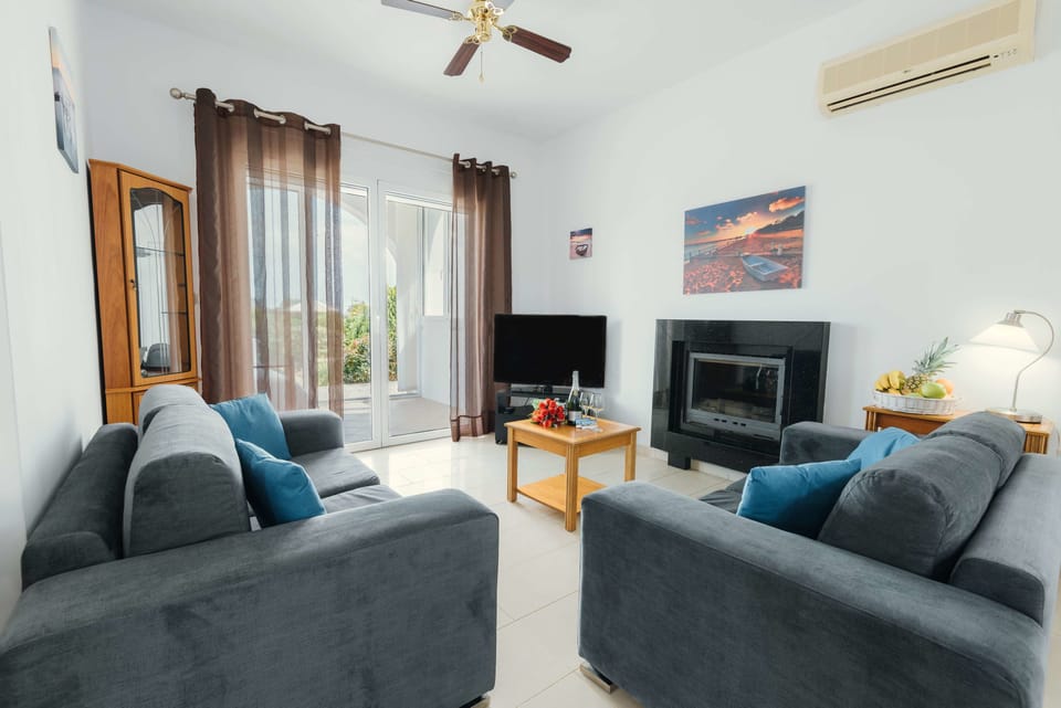 Luxury Villa, 2 Bedrooms, Private Pool, Sea View | Living room | 34-inch flat-screen TV with satellite channels, TV, fireplace