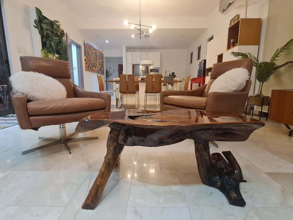 This typical Aruba wooden coffee table is the center of attention in the livingroom.