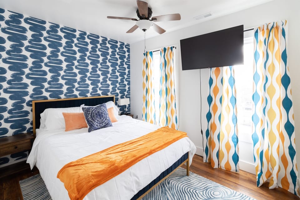 Colorful cozy queen bedroom