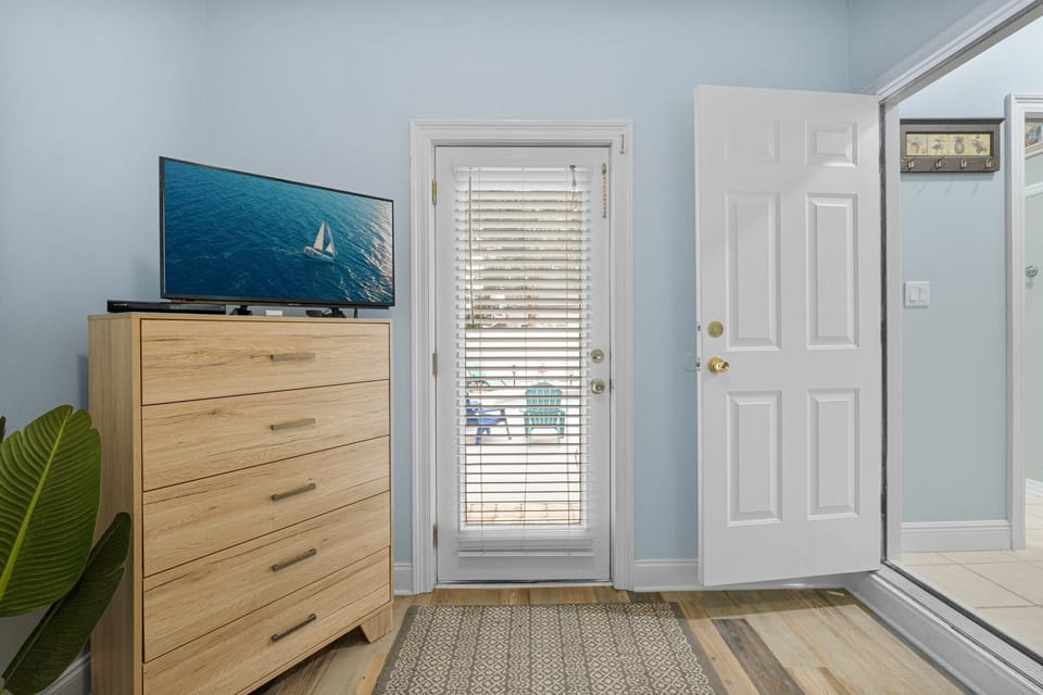 ***MAIN Floor Bedroom #2 with exterior door to pool area 