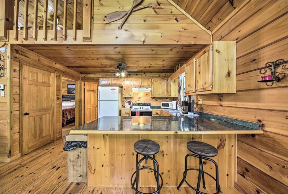full kitchen with bar stool island sitting. Fully stocked Kitchen